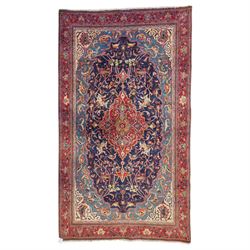North West Persian Sarouk hand-knotted rug, indigo field with central stepped medallion wi...