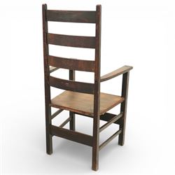 Arts and Crafts oak ladder back armchair in the manner of M H Baillie Scott, the high back with shaped slats and plain uprights, over a solid seat and square arm supports, joined by plain stretchers