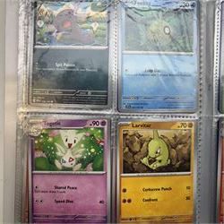 Collection of modern Pokemon TCG trading cards from the Scarlet & Violet and Sword & Shield eras, contained within in two folders, opened packets and loose, together with a graded Sword & Shield Silver Tempest Passiman TG08, GET Graded 9 Mint, two oversized cards, energy cards, vintage booklets and boxes, empty tins, 1998 Electronic Pokédex and other accessories