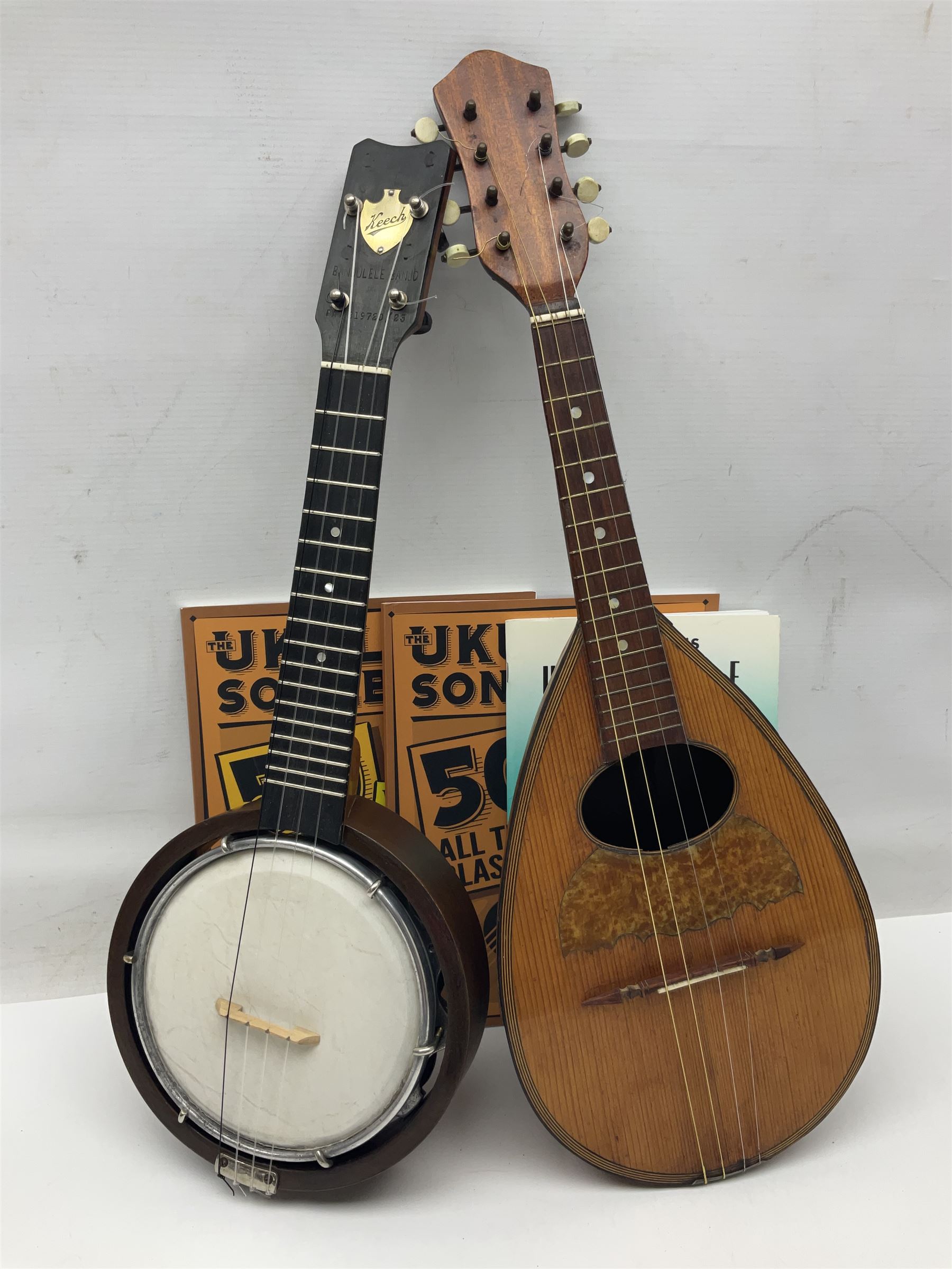W.D. Keech banjolele pat.219720/23 with etched signature to the back; serial no.A12082 L55cm; and a restored Italian mandolin with segmented lute back; together with three music books