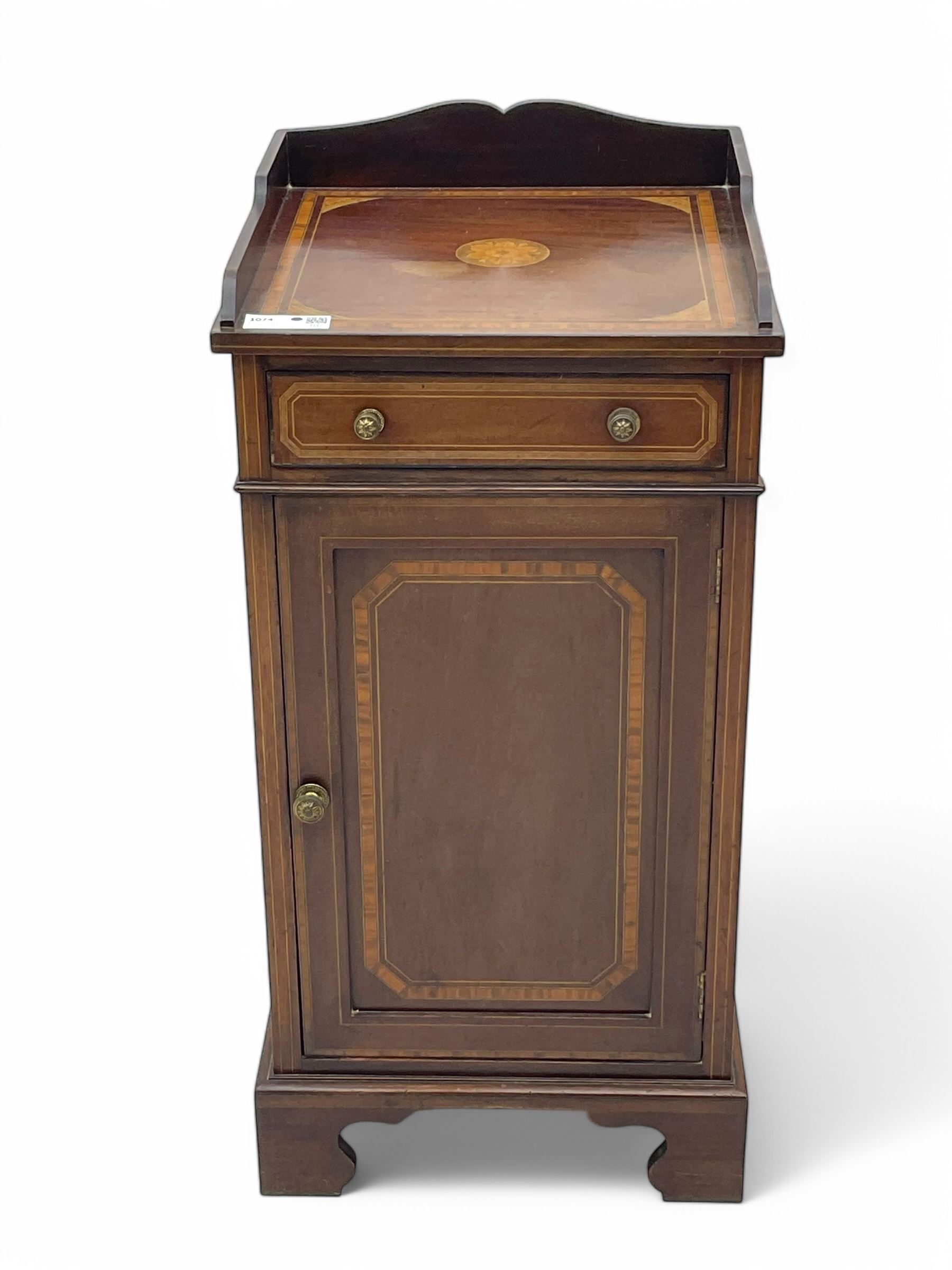 Edwardian mahogany inlaid bedside cabinet, inlaid top with gallery above, single drawer with button handles and single shelf cupboard, on scroll carved bracket feet