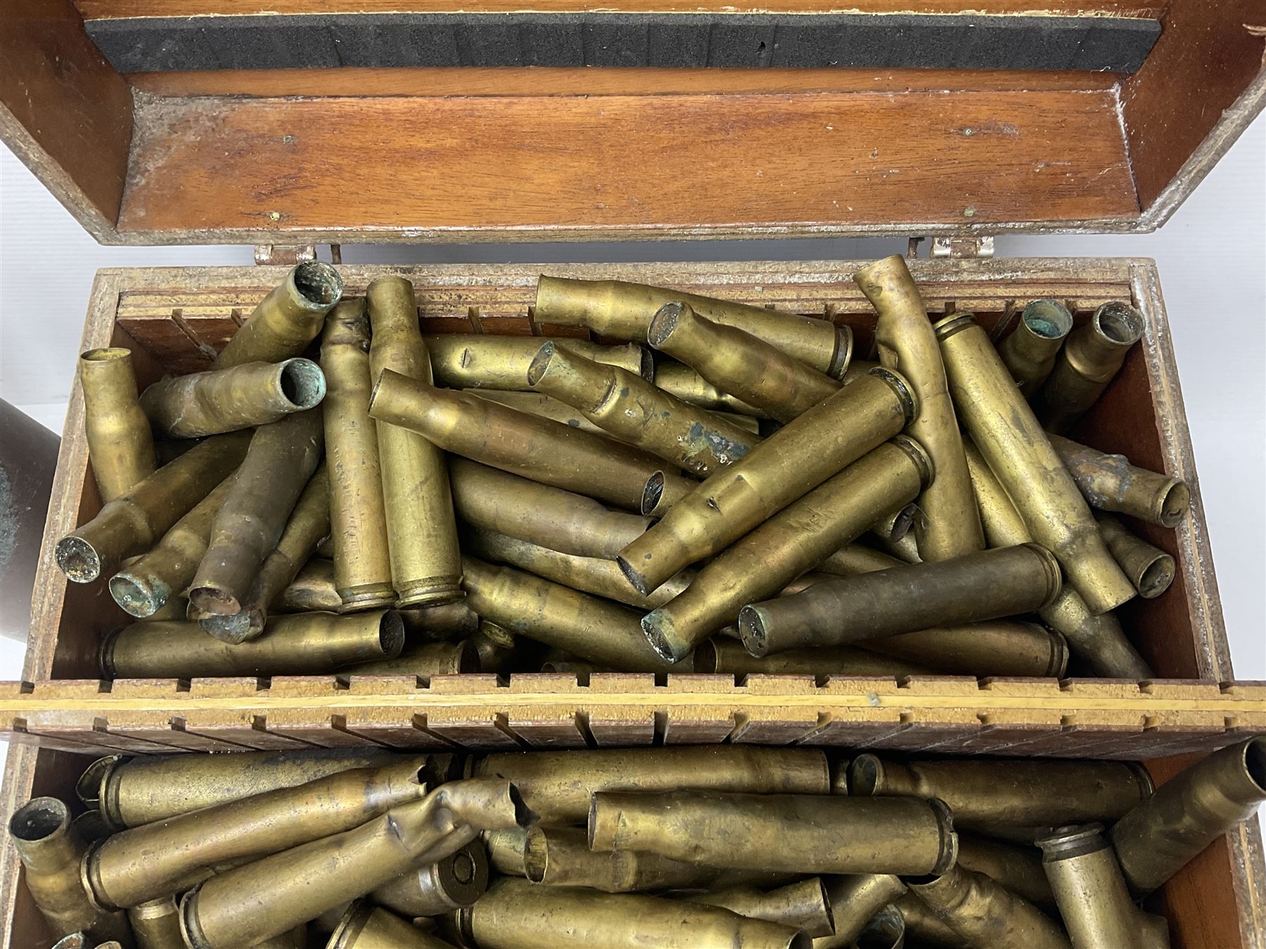 Large collection of shell and bullet casings, including a trench art example, together with a metal cartage case and wooden case