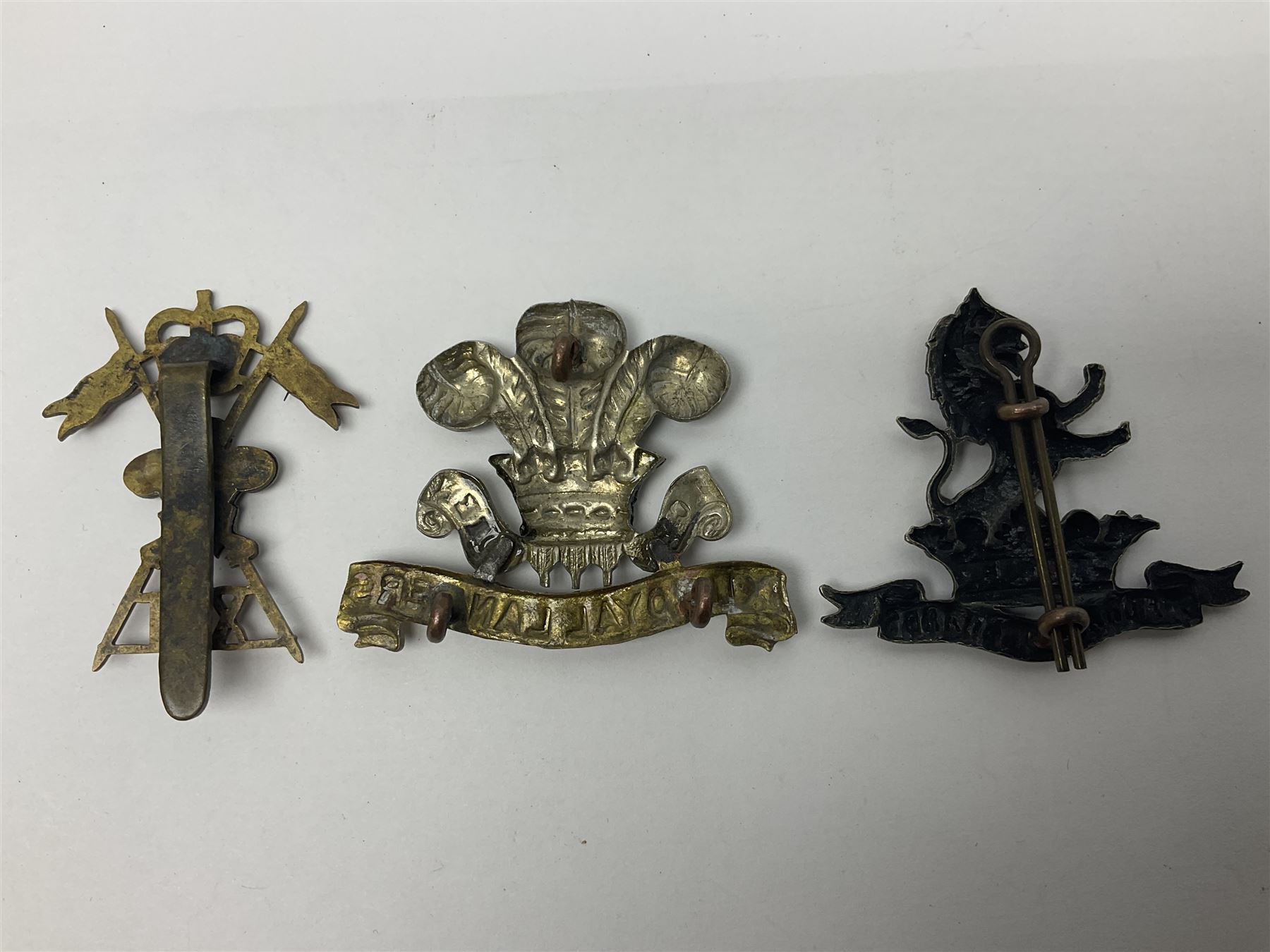 Nine Lancers metal cap badges including 9th, 12th Royals, 24th, 16th Queens and 17th; together with eight various Guards/Dragoons badges (17)