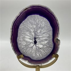 Pair of purple agate slices, polished with rough edges raised upon gilt metal stands