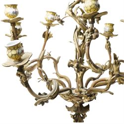 Rococo design brass ten light chandelier with scroll branches and ceramic candle holders H74cm