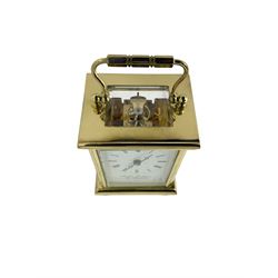 English - contemporary 8-day carriage clock retailed by Martin Dunn, four glass lacquered case with handle raised on bun feet, white enamel dial with Roman numerals and steel moon hands, platform lever escapement with 11 jewels. With key.