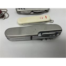 Fifteen folding/pocket knives including Swiss Army type knives with various number of blades, British army jack knife by J.H. Thompson Sheffield dated 1955 with broad arrow, promotional etc (15)