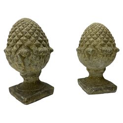 Pair of cast stone garden pineapples gatepost finials, on square base