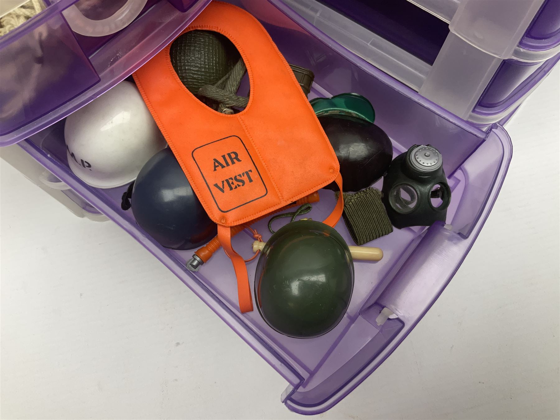 Action Man - five figures marked on the back 'Made in England by Palitoy under licence from Hasbro 1964', one dressed as a German Stormtrooper, one as a Red Devil Pilot and three in army uniform; another similar action figure marked to the right buttock ' G.I. Joe Copyright 1964 by Hasbro Patent Pending Made in Canada' dressed in army uniform; together with an Action Man jeep, field gun, mortar and machine guns and other accessories including helmets and weapons, parachute, diving equipment, skis and snow shoes, boots, uniforms etc; all unboxed