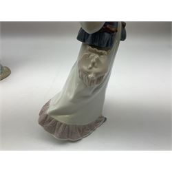 Three Lladro figures, comprising, Dreams of Summer Past no 6401, Spring Breeze no 4936 and Breezy Afternoon 5682 together with Lladro plaque Art Brings us Together no 7677, all in original boxes, largest example H35cm