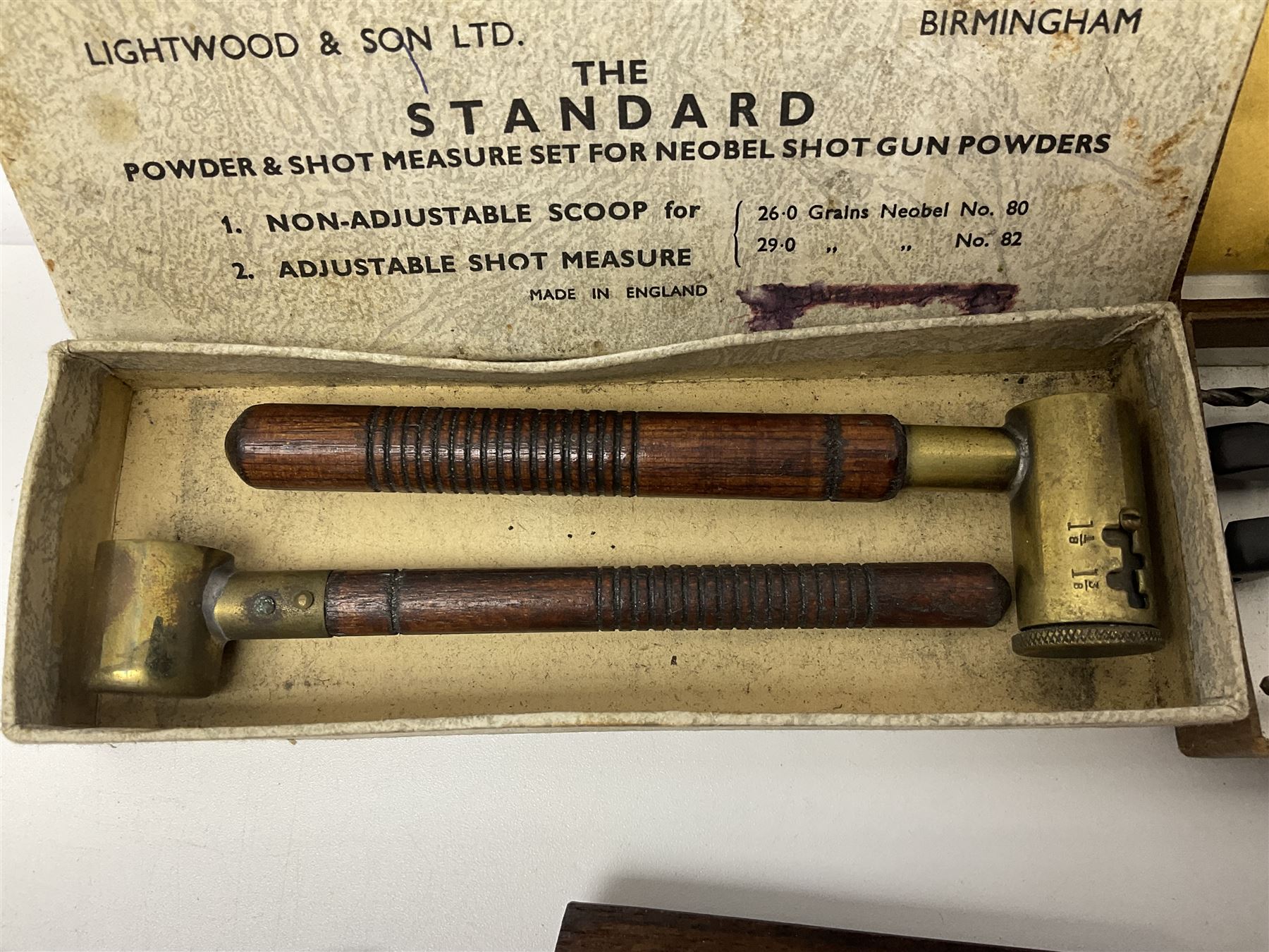 Six pairs of revolver grips;  pair of Lightwood & Son Ltd powder/shot measures in original box; and boxed Colt hammer shroud 