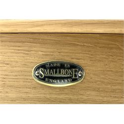 Smallbone light oak bookcase, projecting cornice above two chequered opaque glazed doors enclosing three adjustable shelves