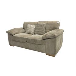 Two seater sofa bed, upholstered in latte cord fabric