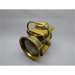  Powell & Hamner brass acetylene Motor Headlamp, the pierced shaped body with two side brackets, hinged top and rear covers, top handle and 15cm clear convex lens, stamped on top and base, H27cm  