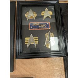 Collection of Star Trek The Next Generation and Deep Space Nine memorabilia, including two limited edition signed Star Trek Deep Space Nine photographs, commemorative porcelain plaque, insignias, Encounter at Farpoint pewter plaque, signed photograph of the Voyager crew, two signed copies of Convergence and a signed War & Madness graphic novel, canvas prints and other signed photos, together with Star Wars Ray Park (Darth Maul) signed photograph, UFO and Buck Rogers memorabilia