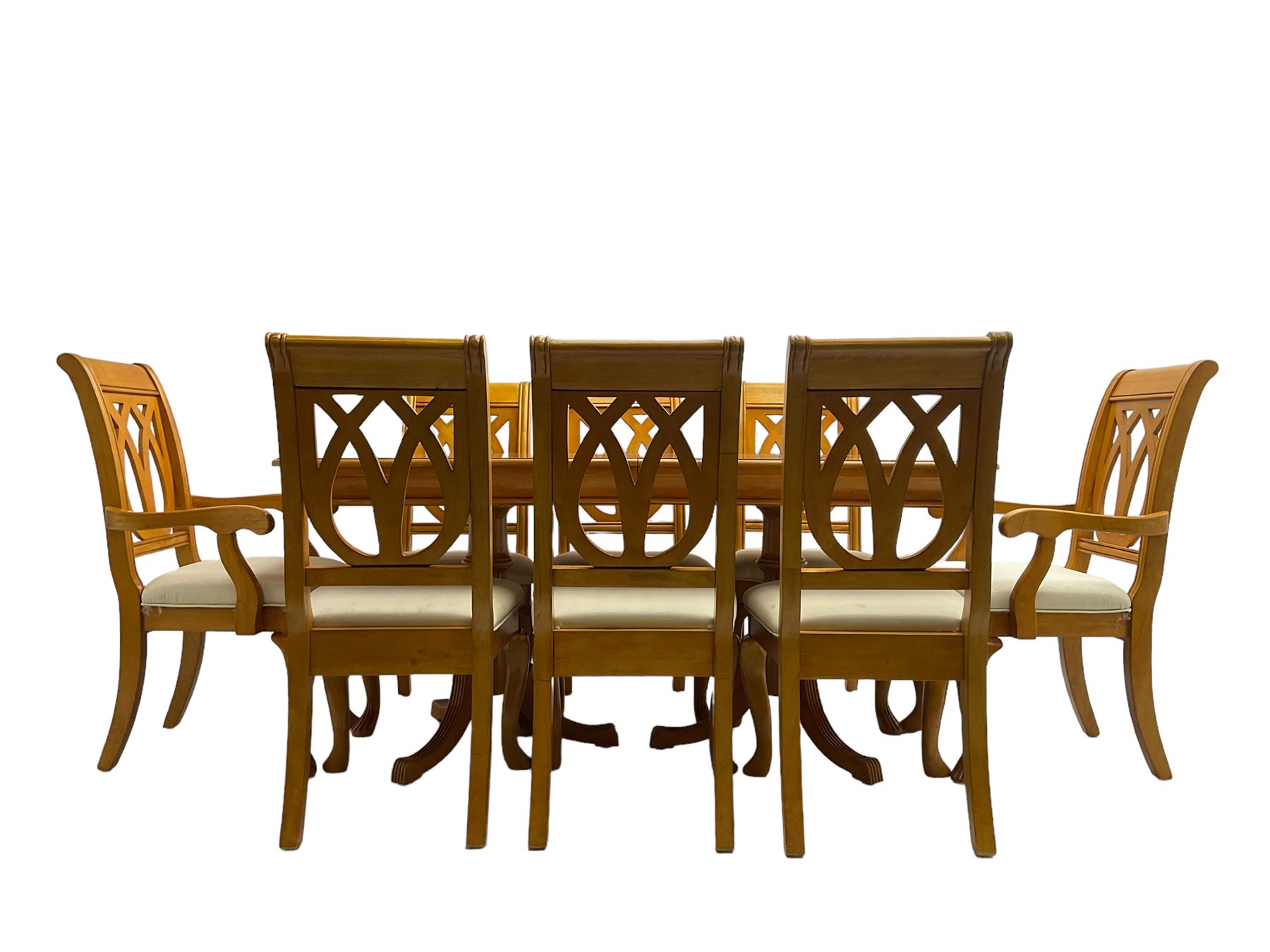 Yew wood extending twin pedestal dining table, rectangular top with ebony stringing over turned and reeded vasiform pedestals on tripod bases, with two additional leaves (W159cm D92cm); and set of eight (6+2) matching dining chairs, high pierced backs over seats upholstered in ivory fabric, on cabriole supports (W57cm H101cm)