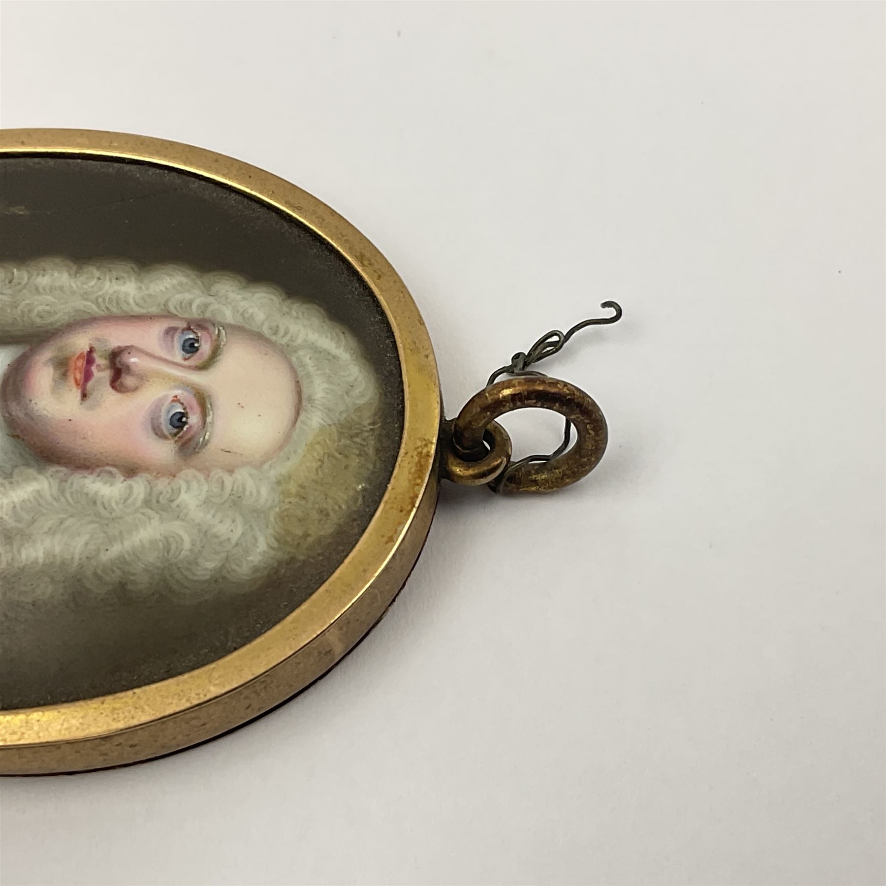 In the manner of Christian Zincke (German 1683-1767)
Portrait miniature upon enamel, circa 1750
Head and shoulder portrait of a gentleman in blue coat, possibly George II 
Within 9ct gold frame with ivory panel verso
Oval 4.5cm x 3.5cm

This item has been registered for sale under Section 10 of the APHA Ivory Act