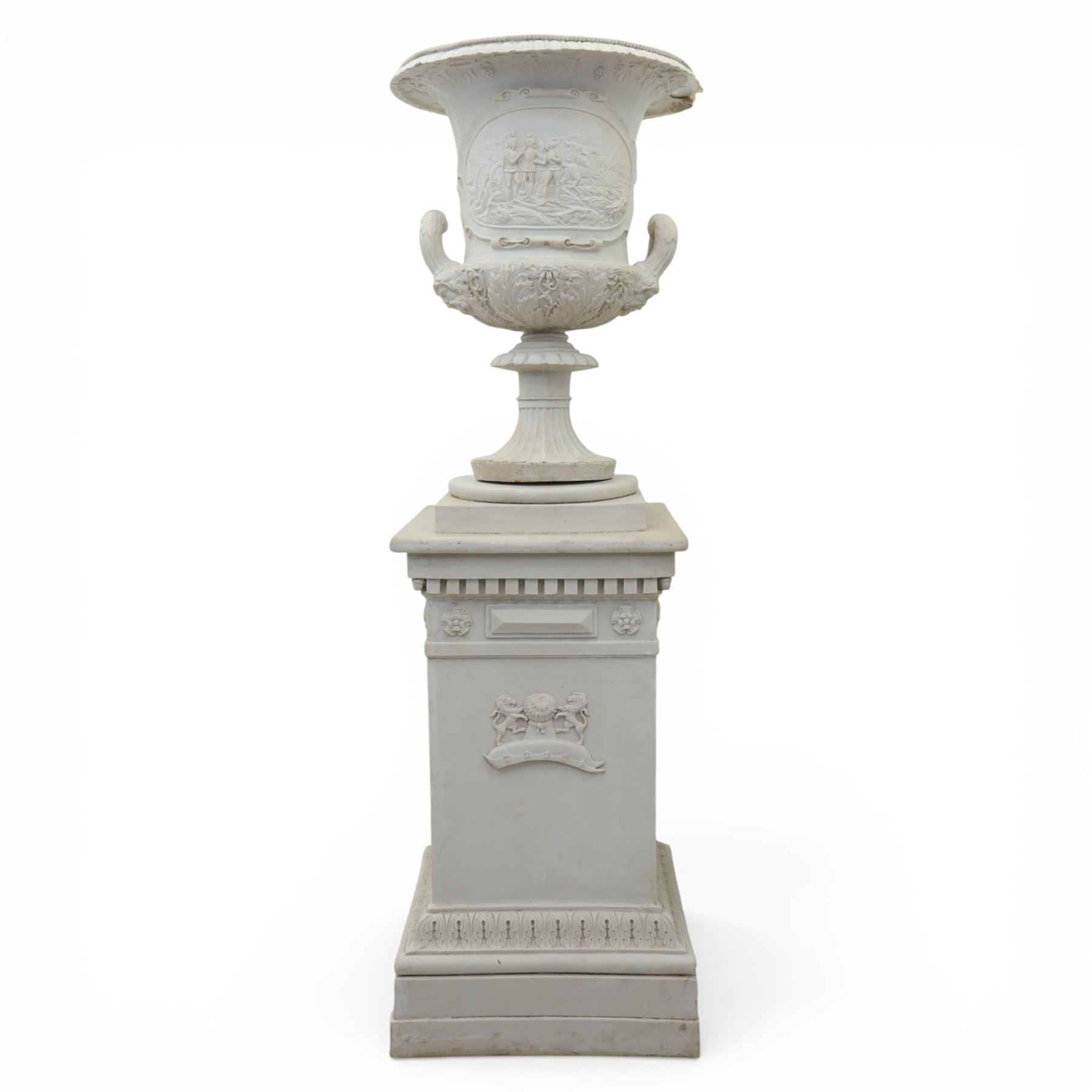 Pair of composite campana urns on stands, the urns decorated with relief figural panels and foliate bands with scrolling handles, on circular socles, the pedestals of square tapering form with moulded edges and applied classical motifs