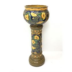 A large early 20th century faience pottery jardinière on stand, both decorated with panels of yellow flowers, with impressed marks beneath Faience 2284, overall H100.5cm, jardinaire 35.5cm. 