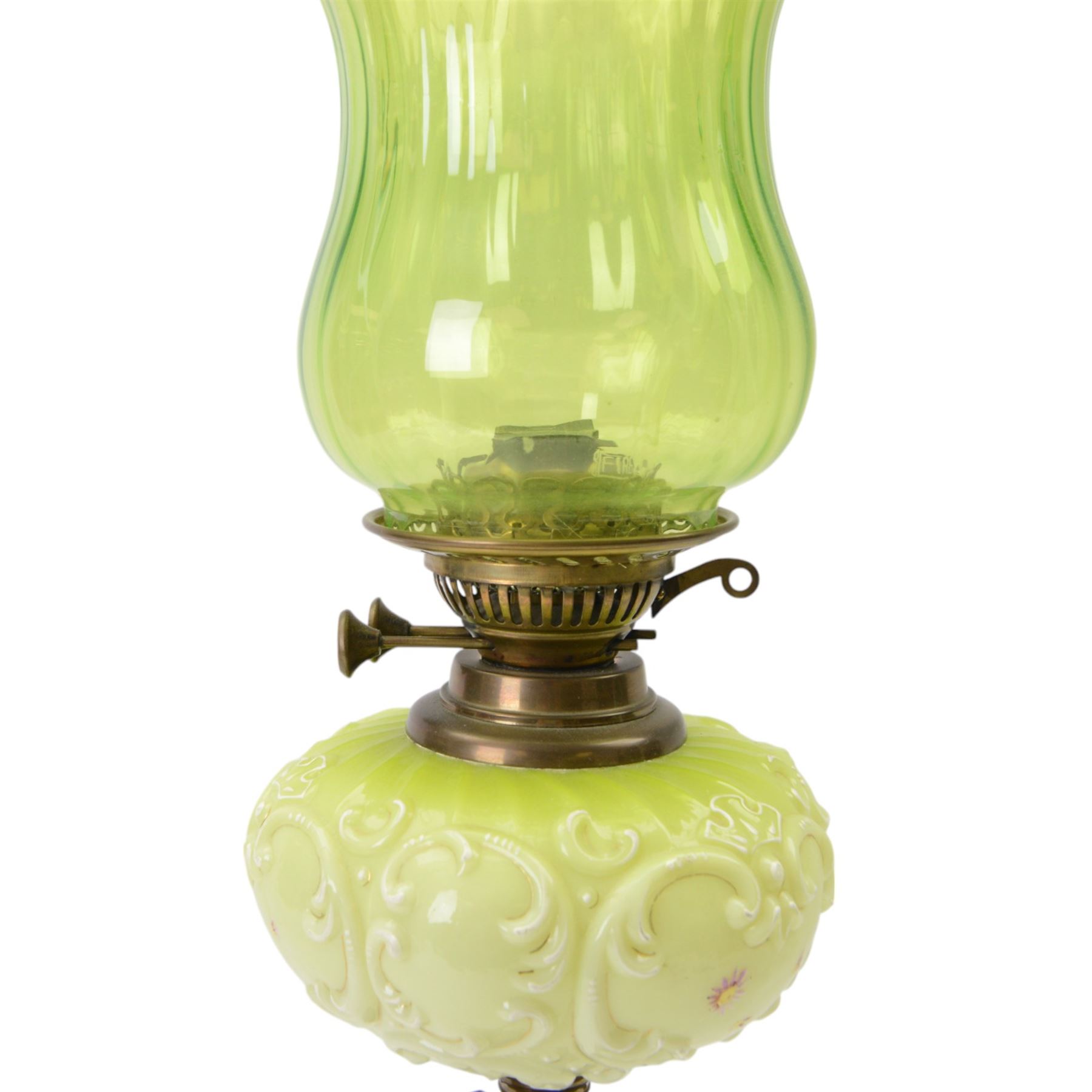 Green glass and brass oil lamps, with frilled glass shade, reservoir decorated with flowers, upon corinthian column with square base, H74cm
