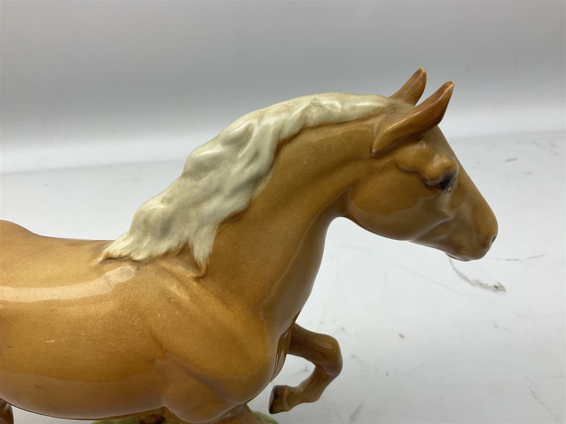 Beswick figure of cantering Palomino horse on base model no 1374, with impressed and printed mark beneath, H18cm