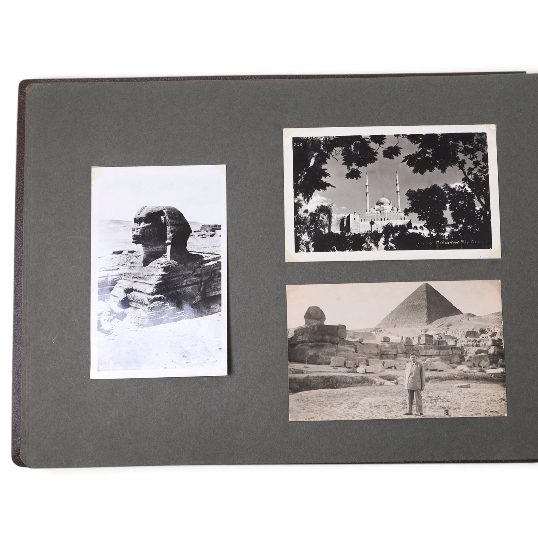 Two early to mid 20th century postcard albums, containing black and white and colour postcards of France, Turkey and Egypt, together with some personal photographs and newspaper clippings