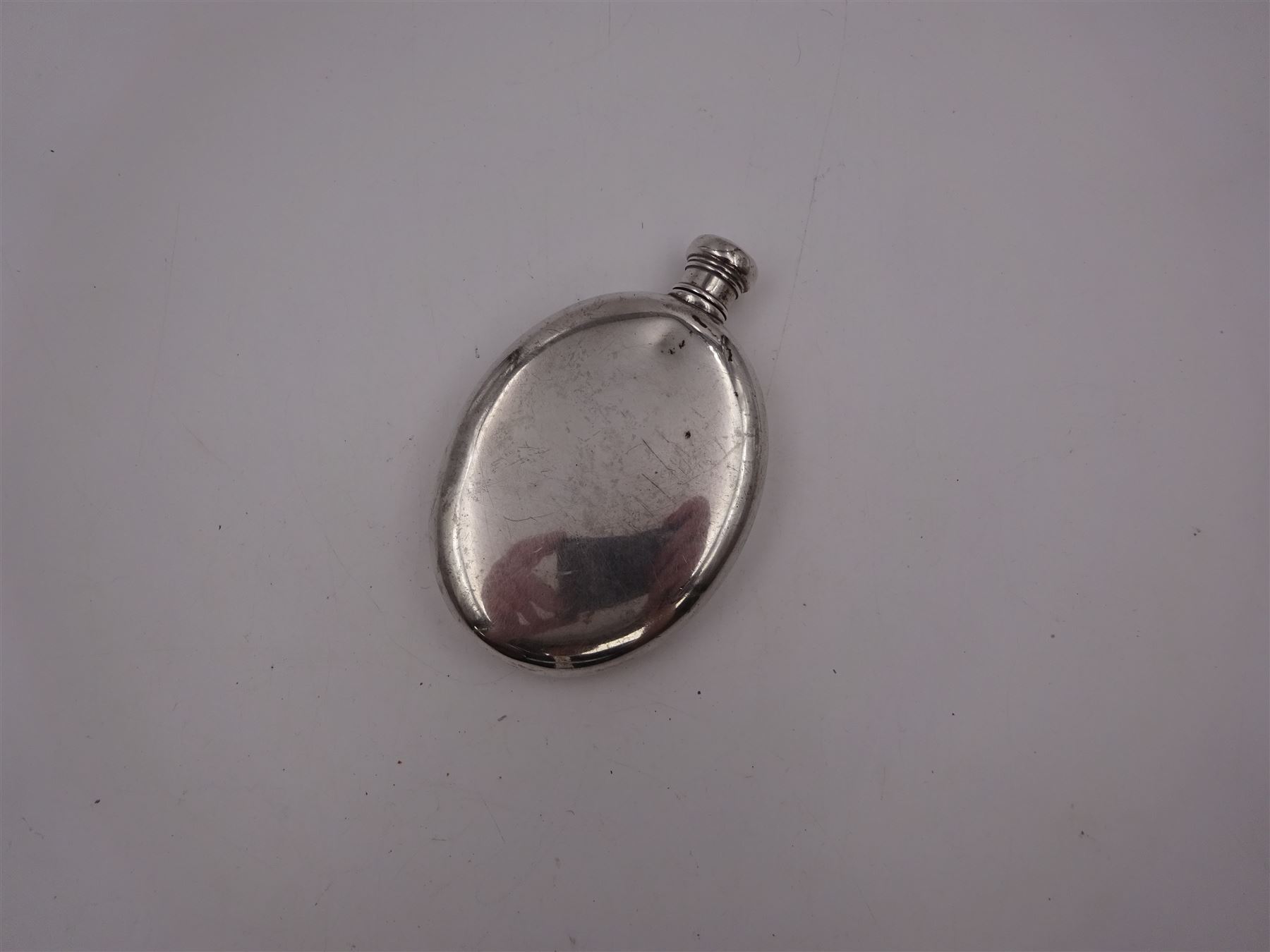 Tiffany & Co silver hip flask, of oval form with screw cap, stamped Tiffany & Co  26503327 Sterling Silver beneath, H11.5cm