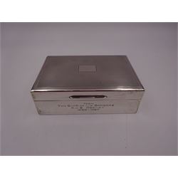 Mid 20th century silver mounted cigarette box, of rectangular form, with presentation engraving to body reading 'From The Captain and Officers HMS Rocket 1960 - 1962', with engine turned decoration to hinged cover opening to reveal a softwood lined compartmentalised interior, hallmarked S J Rose & Son, London 1961, H4.5cm, W13.3cm, D8.8cm