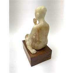Ann Baxter (British b. 1969): Alabaster figure of a seated lady on rectangular wooden plinth, H22cm overall 