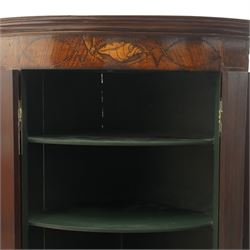 Georgian inlaid walnut cylindrical corner cupboard, projecting cornice over a banded frieze with inlaid shell motif, enclosing three shelves with two spice drawers fitted to base