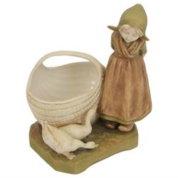 Royal Dux figural bowl, modelled as a young lady lying beside a shell, impressed 562`to base, together with Royal Dux Dutch girl figural baskets, modelled with geese and chickens next to woven baskets, impressed 2278 to base, largest H26cm