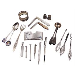 Group of silver, to include two mother of pearl handled fruit knives with silver blades, silver Lady Yard-O-Lette propelling pencil, modern silver Lincoln imp page marker, two salt spoons, two souvernir spoons, two thimbles, napkin ring, silver handled manicure items, etc, all stamped or hallmarked, together with a white metal toothpick, stamped S.Mordan & Co and white metal propelling pencil