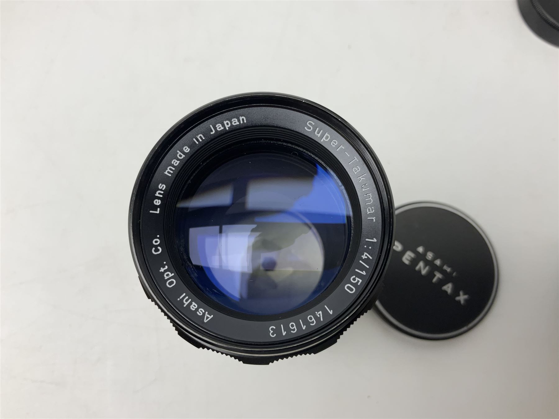 Asahi Pentax S1a camera body, serial no. 707071, with 'Super-Takumar 1:1.8/55' lens, serial no 2124044, together with Asahi Pentax Sv camera body, no. 1925617 with 'Super-Takumar 1:2/55' lens, serial no. 2770153, Asahi Pentax Meter, 'Super-Takumar 1:3.5/28' lens, serial no. 2075492 and 'Super-Takumar 1:4/150' lens, serial no. 1461613  
