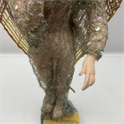 Anna Meszaros Hungary - hand made needlework figurine of an Angel with metallic lace full length dress and open threadwork wings; on moulded base H45cm Auctioneer's Note: Anna Meszaros came to England from her native Hungary in 1959 to marry an English businessman she met while demonstrating her art at the 1958 Brussels Exhibition. Shortly before she left for England she was awarded the title of Folk Artist Master by the Hungarian Government. Anna was a gifted painter of mainly portraits and sculptress before starting to make her figurines which are completely hand made and unique, each with a character and expression of its own. The hands, feet and face are sculptured by layering the material and pulling the features into place with needle and thread. She died in Hull in 1998.