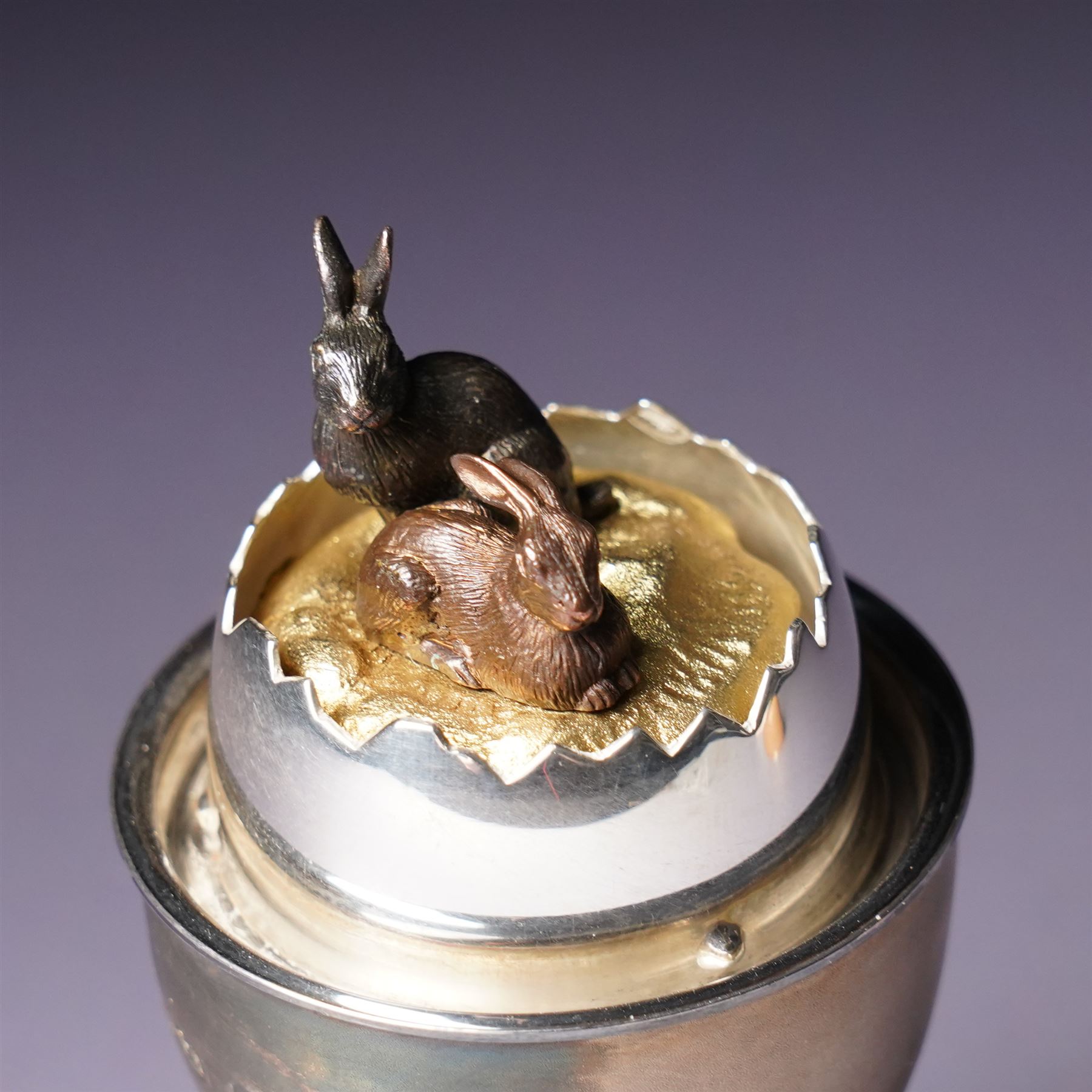 Anthony Gordon Elson -  Elizabeth II limited edition novelty silver and silver gilt surprise egg, the cup holding a gilt lined egg, bayonet opening to reveal two bunnies 4/200  H11cm London 1981