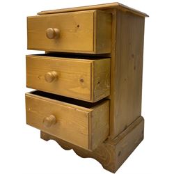 Pair of traditional pine bedside pedestal chests, fitted with three drawers