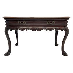19th century Irish mahogany serving or side table, the moulded rectangular top over moulded frieze with drawer, bellflower festoon handles, cushion moulded and shaped lower rail carved with scrolling foliage, the cabriole supports carved with extending bellflowers and scrolls, on carved paw feet
