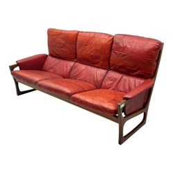 Folke Ohlsson for Gimson & Slater - mid-20th century Danish teak-framed sofa, red leather upholstery with patchwork design, raised on shaped teak side supports