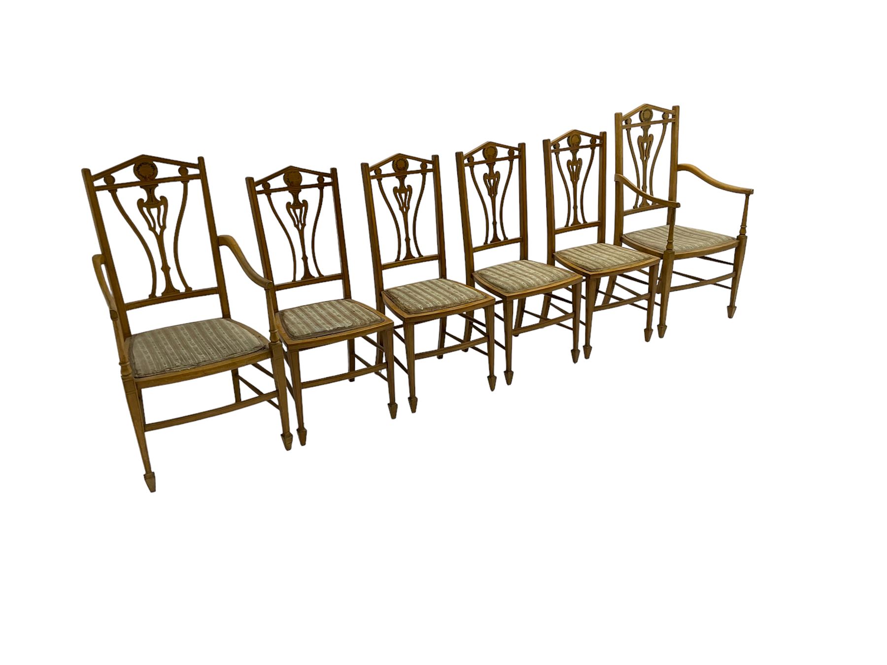 Set six (4+2) Edwardian satinwood dining chairs, triangular cresting rail painted with laurel wreath, shaped and pierced splat flanked by two shaped upright rails, with boxwood stringing, upholstered seats, on square tapering front supports with spade feet