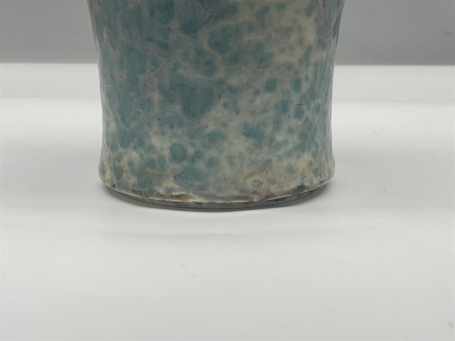 Holyrood Pottery vase of bulbous form decorated in a mottled and streaked green and blue glaze, with printed mark beneath, H24cm