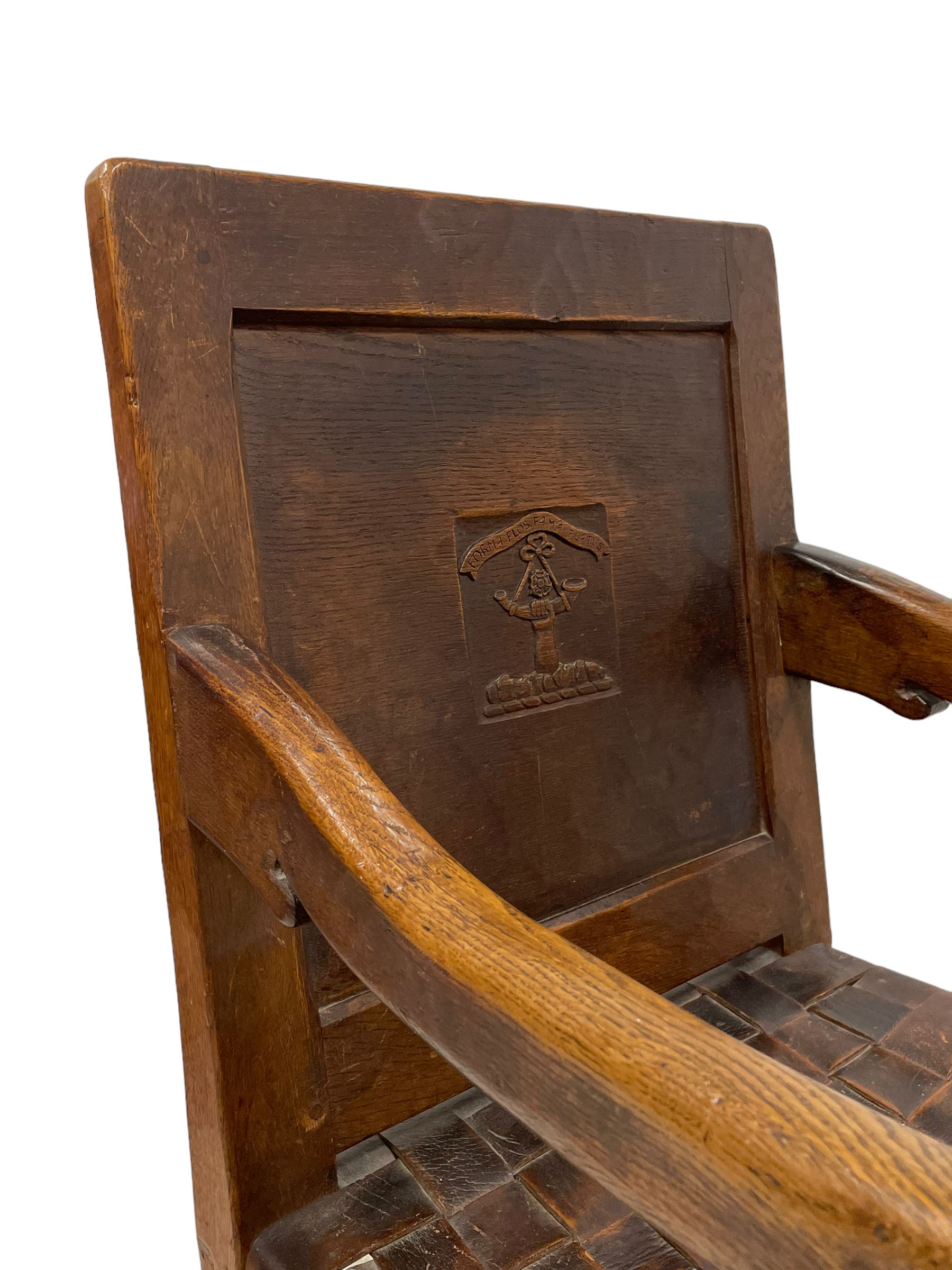 Mouseman - circa. 1930s set of six (4+2) oak dining chairs, panelled back carved with the Bagshawe family crest, the moto 'Forma Flos Fama Flatus' over an arm grasping a bugle-horn with ribbon tie and Yorkshire rose motif, adzed frame, leather lattice strap seat, on octagonal supports united by stretchers, two carvers and four side chairs, each carved with mouse signature, by Robert Thompson of Kilburn 

Provenance: Owned since manufacture by the Bagshawe family, descendants of the Staithes Group Artist Joseph Richard Bagshawe RBA (1870-1909).