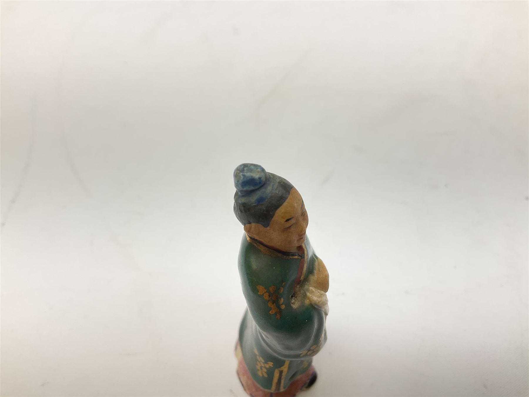 Japanese parquetry puzzle box L12cm; another Japanese puzzle box with marquetry top of Mount Fuji; eleven graduated Chinese figures including immortals; and Chinese figure of a lady standing on a hardwood base next to a horn table (14)