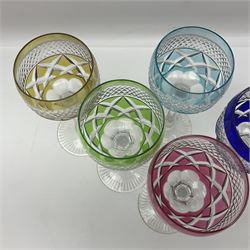 Set of six Harlequin coloured glass hock glasses, each with a band of hobnail decoration, upon faceted stems, H19.5cm