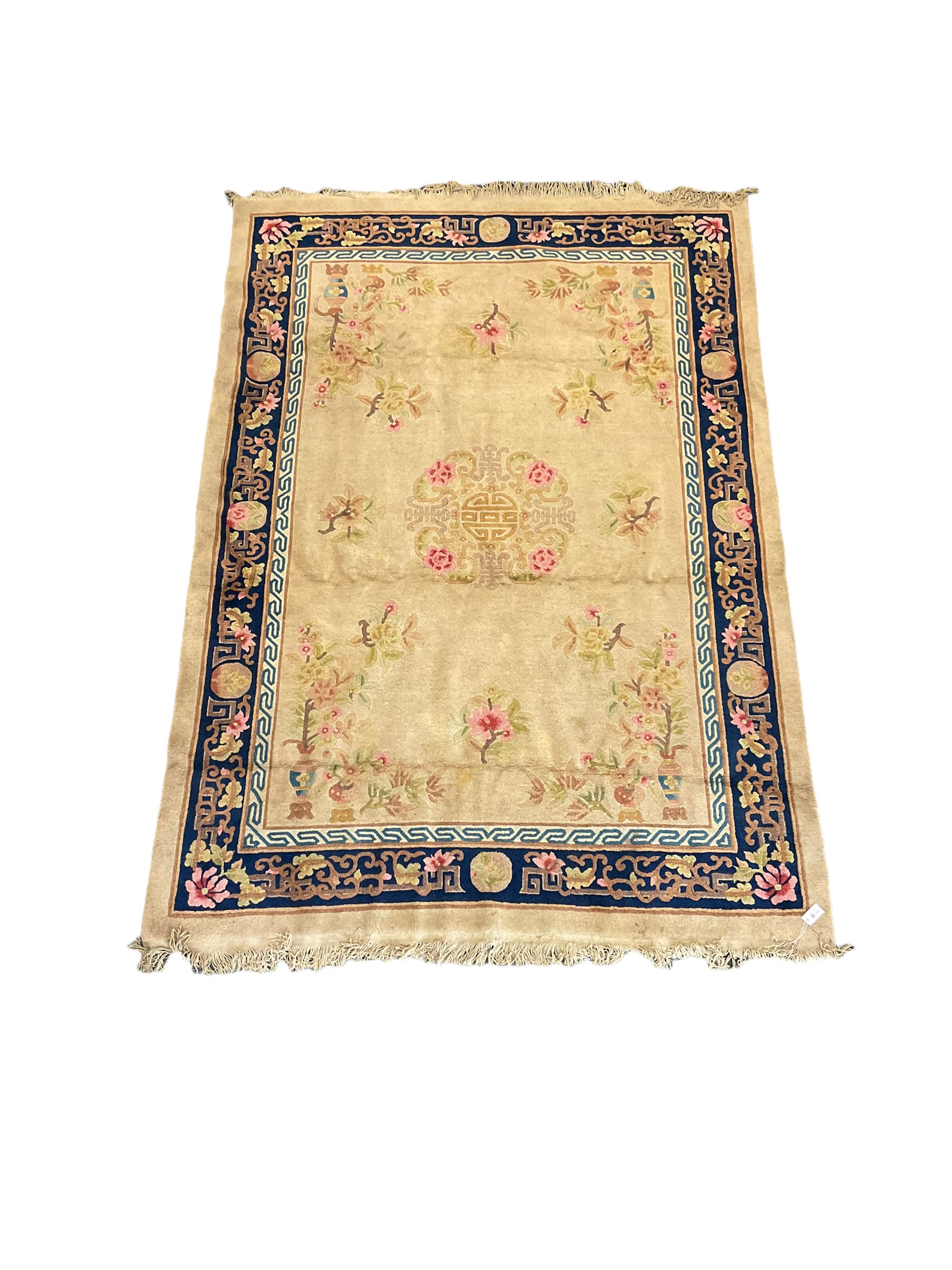 Chinese beige ground rug, blue border
