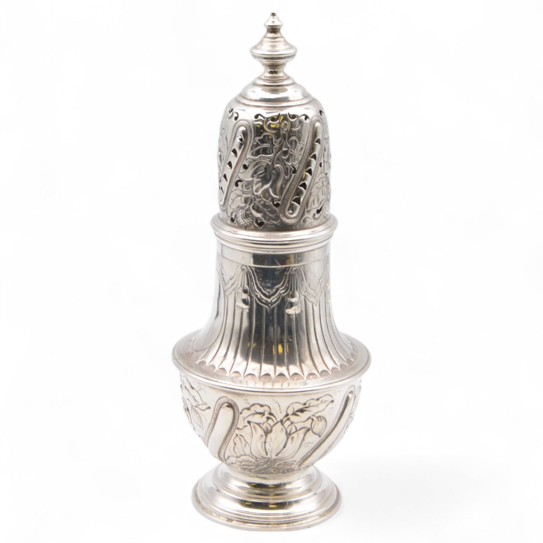 Victorian silver sugar caster, of typical waisted form with engraved and embossed floral and berry decoration, the removable pierced cover with urn finial, upon a circular stepped foot, hallmarked Charles Edwards, London 1884, H20.5cm