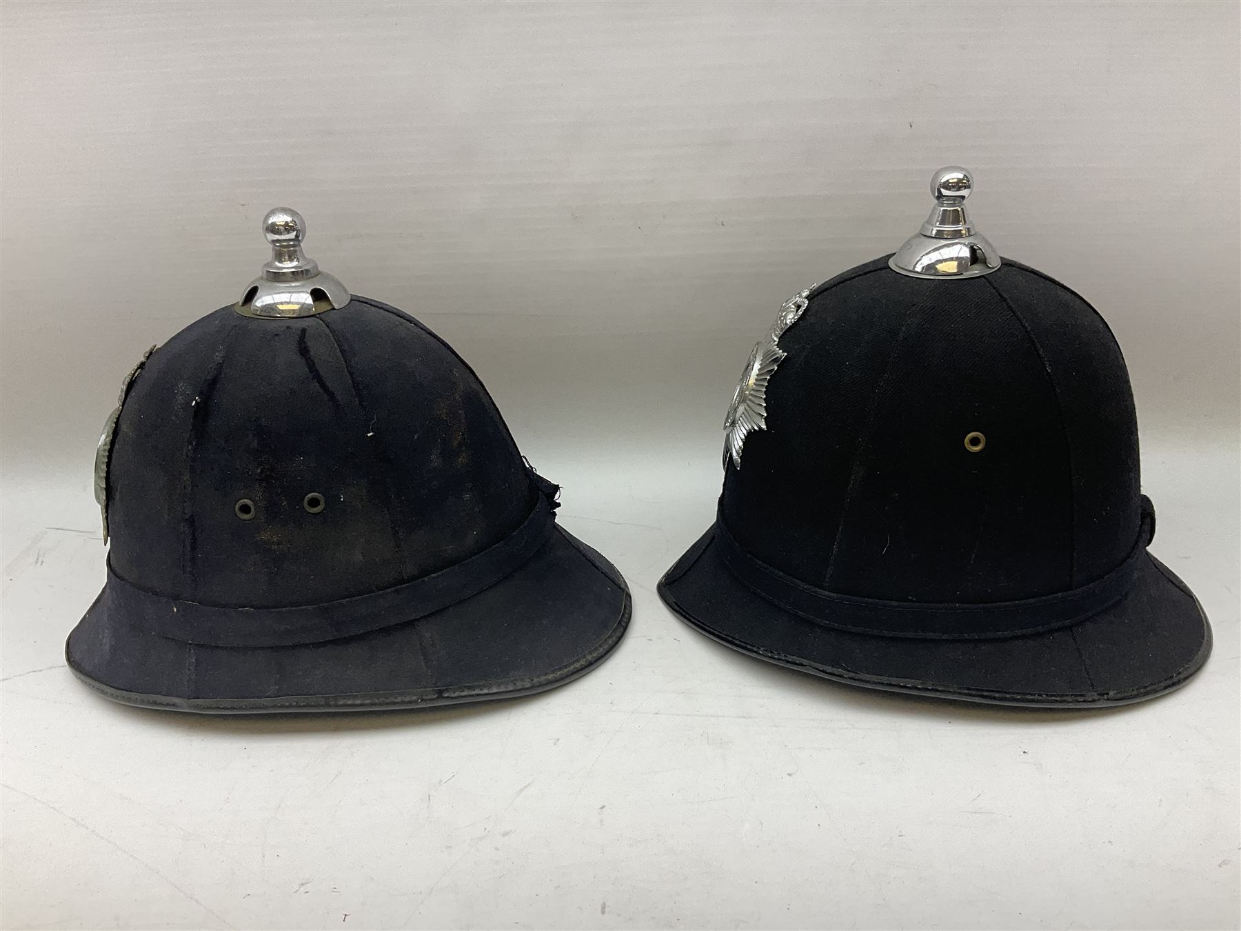 Hull City Police - helmet with king's crown night plate; two further ball-top helmets with Queen's crown plates; and a peaked cap (4)