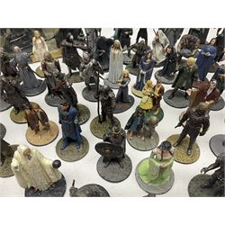 Approximately 80 NLP Lord of the Rings heavy metal painted figurines to include Fell Beast, boxed, and The Watcher, The Dark Lord Sauron, Treebeard etc, and unassociated Dracula themed composite figures marked HHFT50 