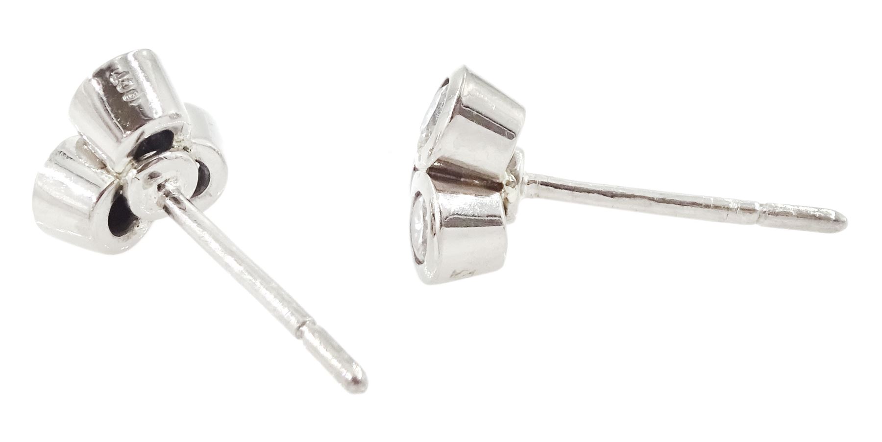 Pair of white gold bezel set, round brilliant cut diamond cluster stud earrings, total diamond weight approx 0.65 carat