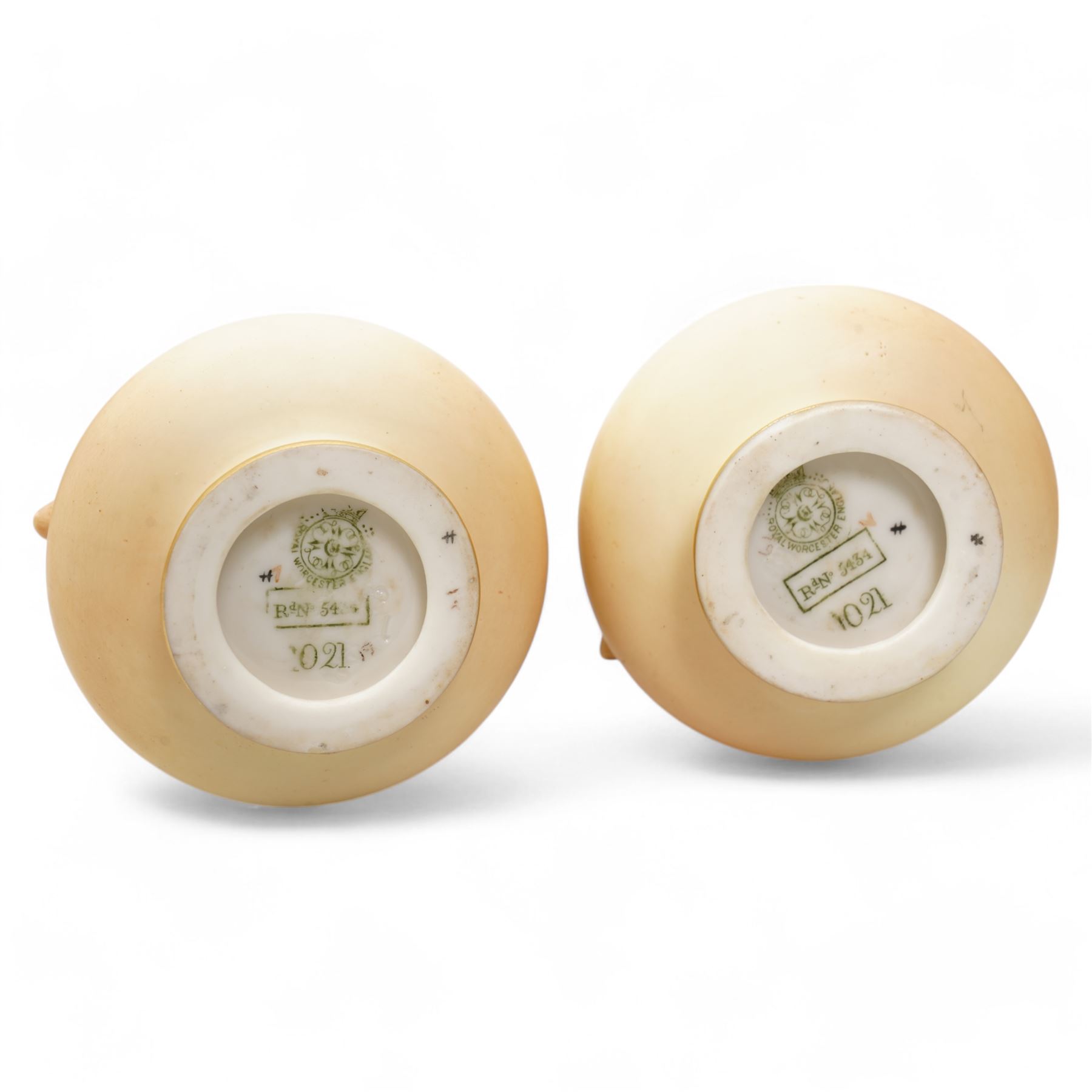 Royal Worcester blush ivory porcelain to include a pair of jugs, no. 1094, pair of vases, no. 1021, and a small ewer no. 1094 (5)