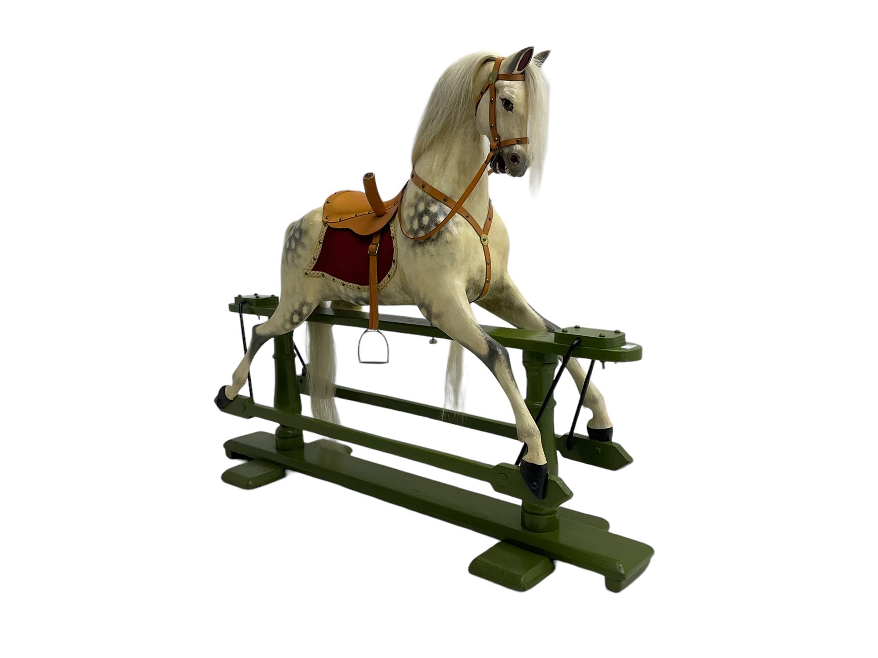 Attributed to F. H. Ayres - early 20th century carved wooden dapple grey rocking horse, with leather saddle and tack, with glass eyes, on green painted trestle base with turned column supports